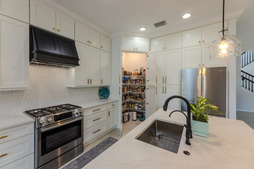 Walk-in pantry with custom shelving in a remodeled kitchen
